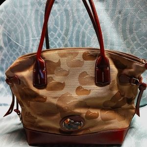 Dooney and Bourke two tone brown with leather trim used smoke and pet free.